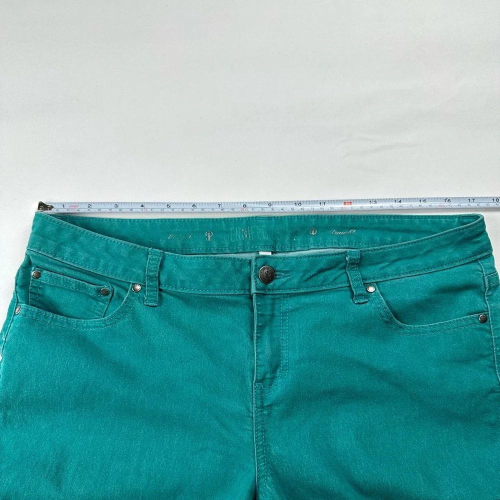 JLo straight jeans. Stretchy. Teal with zipper at ankle. Size 12